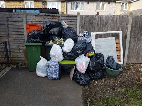 People sorting old furniture for disposal in Millbank