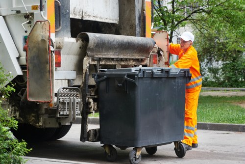 Builders managing construction debris in Millbank